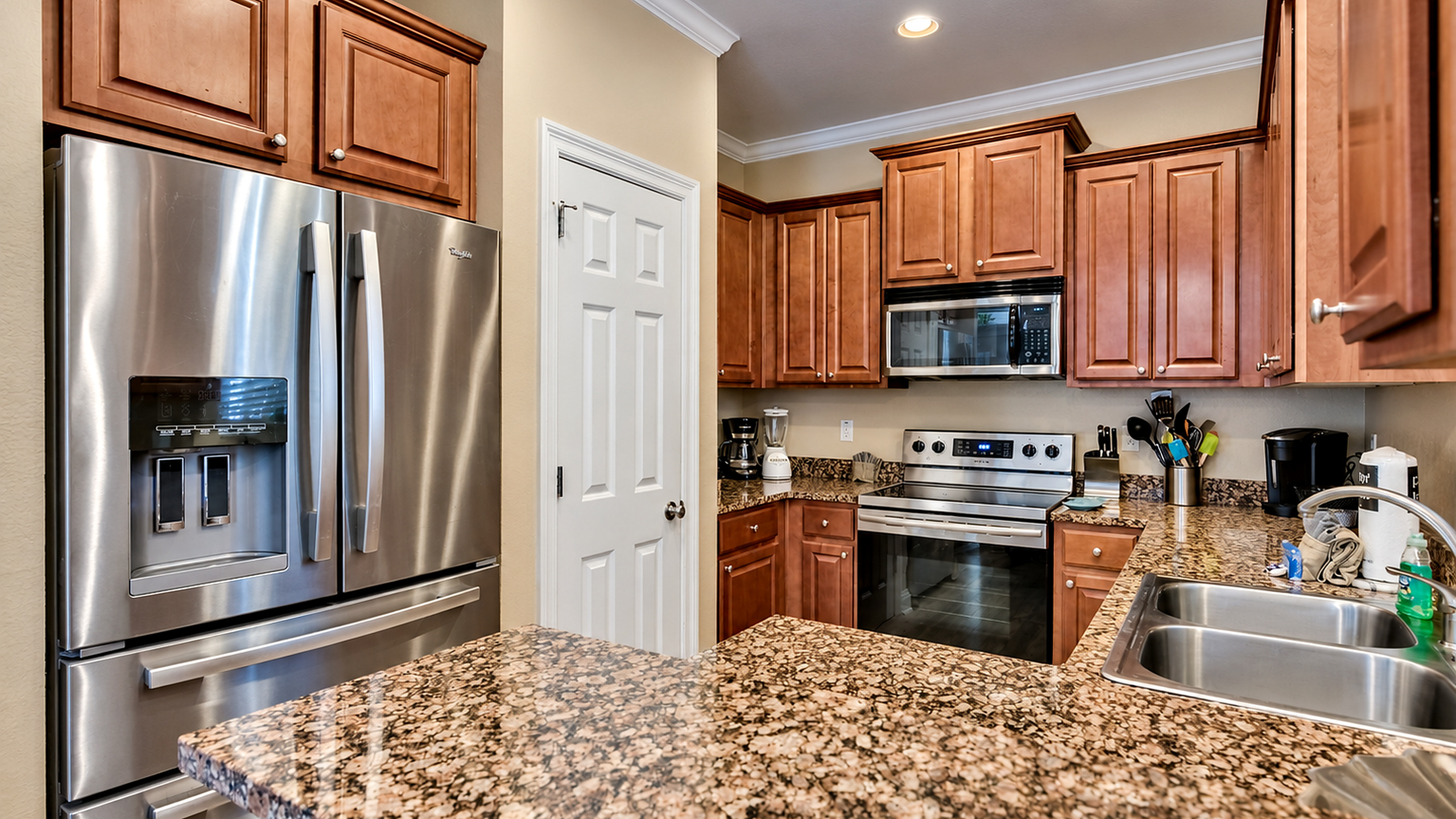 Kitchen has a full-sized refrigerator, coffee maker, stove, oven and more! All here to make meal prep a breeze!