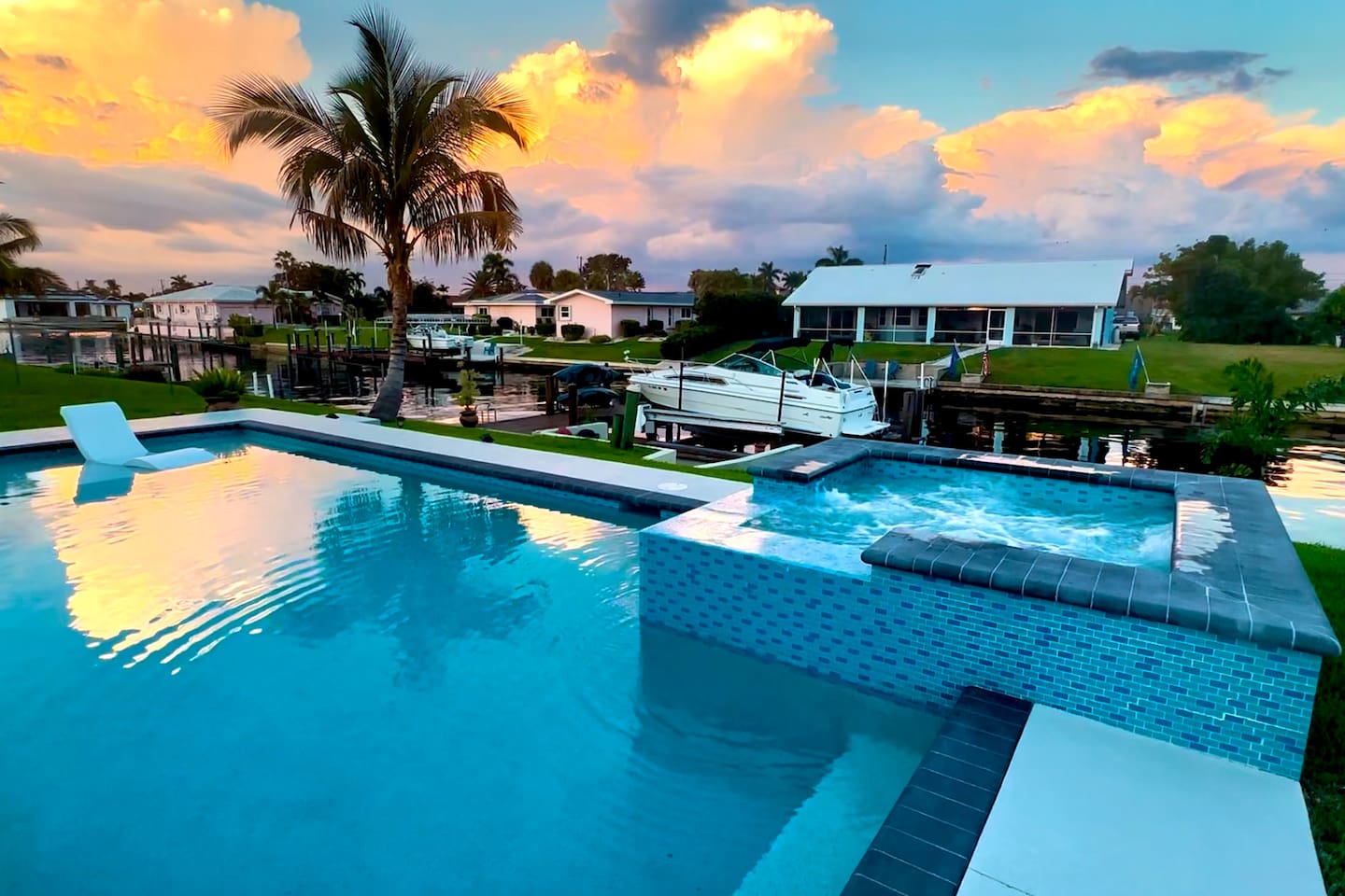 Sunset reflections over the pool and spa