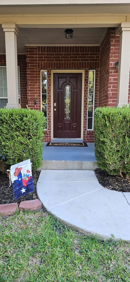 Charming brick exterior with inviting front porch.
