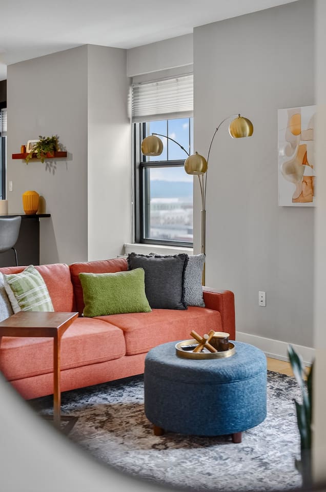 Whip up meals with a view—this spacious kitchen offers plenty of counter space, modern appliances, and bright windows framing the city skyline. Perfect for long stays or short city escapes.