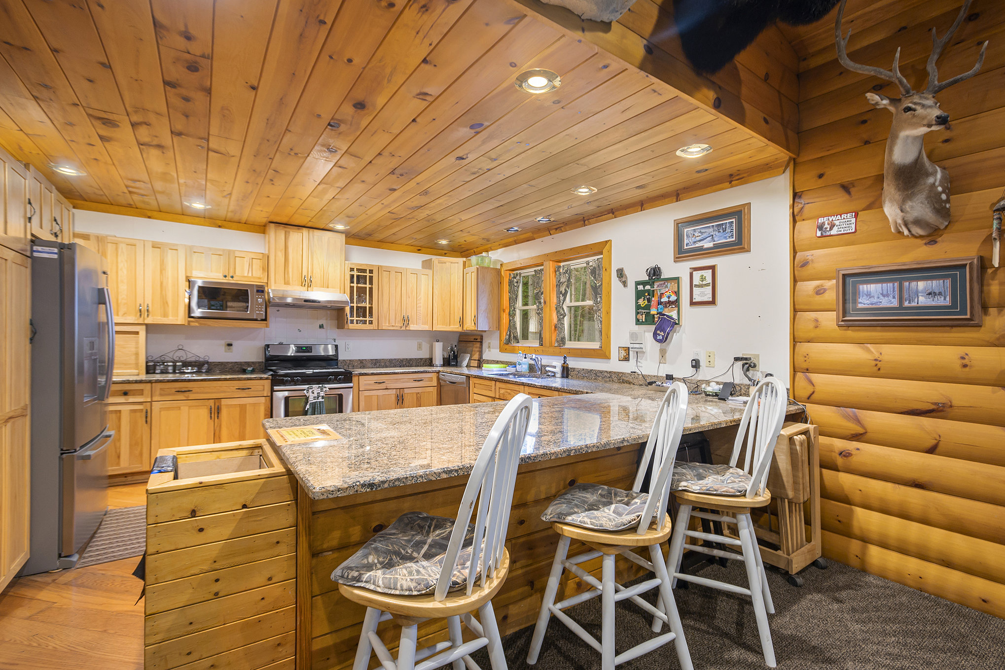 Kitchen with high top bar stools