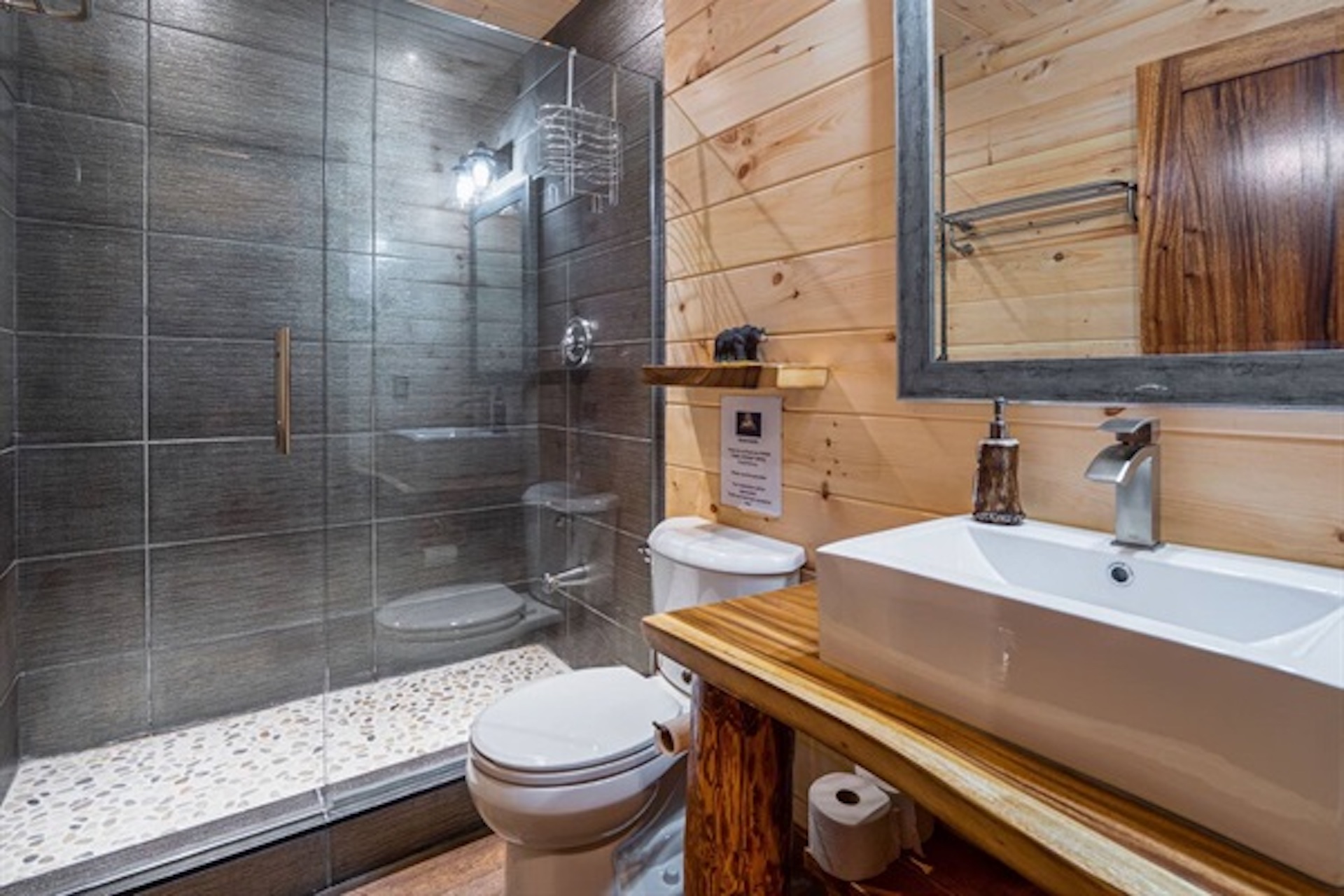Modern bathroom with glass shower and bright vanity