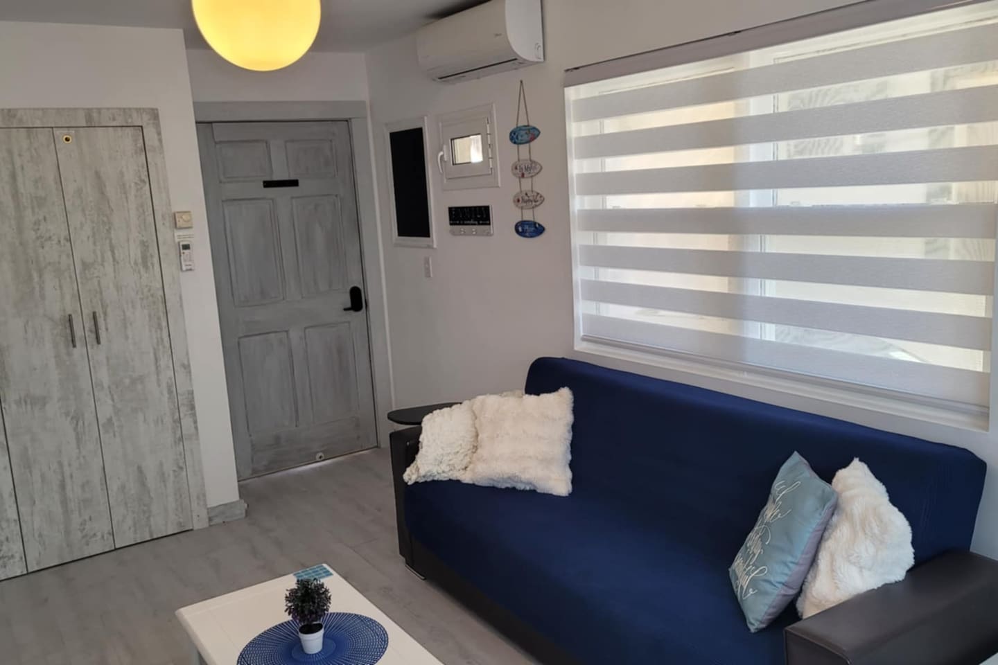 Futon sofa folds down into a single bed, remote controlled Air conditioning.