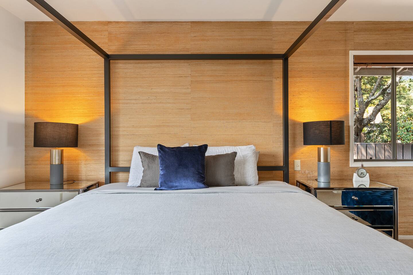 King Bedroom #1. It has a large walk-in closet, attached bathroom, and library nook with a twin daybed (2 twin beds). This bedroom is located off the main hallway on the top floor.