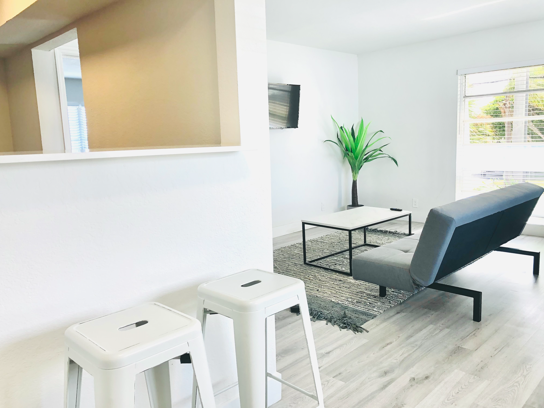 Entry way featuring counter bar area. Futon replaced with queen sofa bed that sleeps two guests.