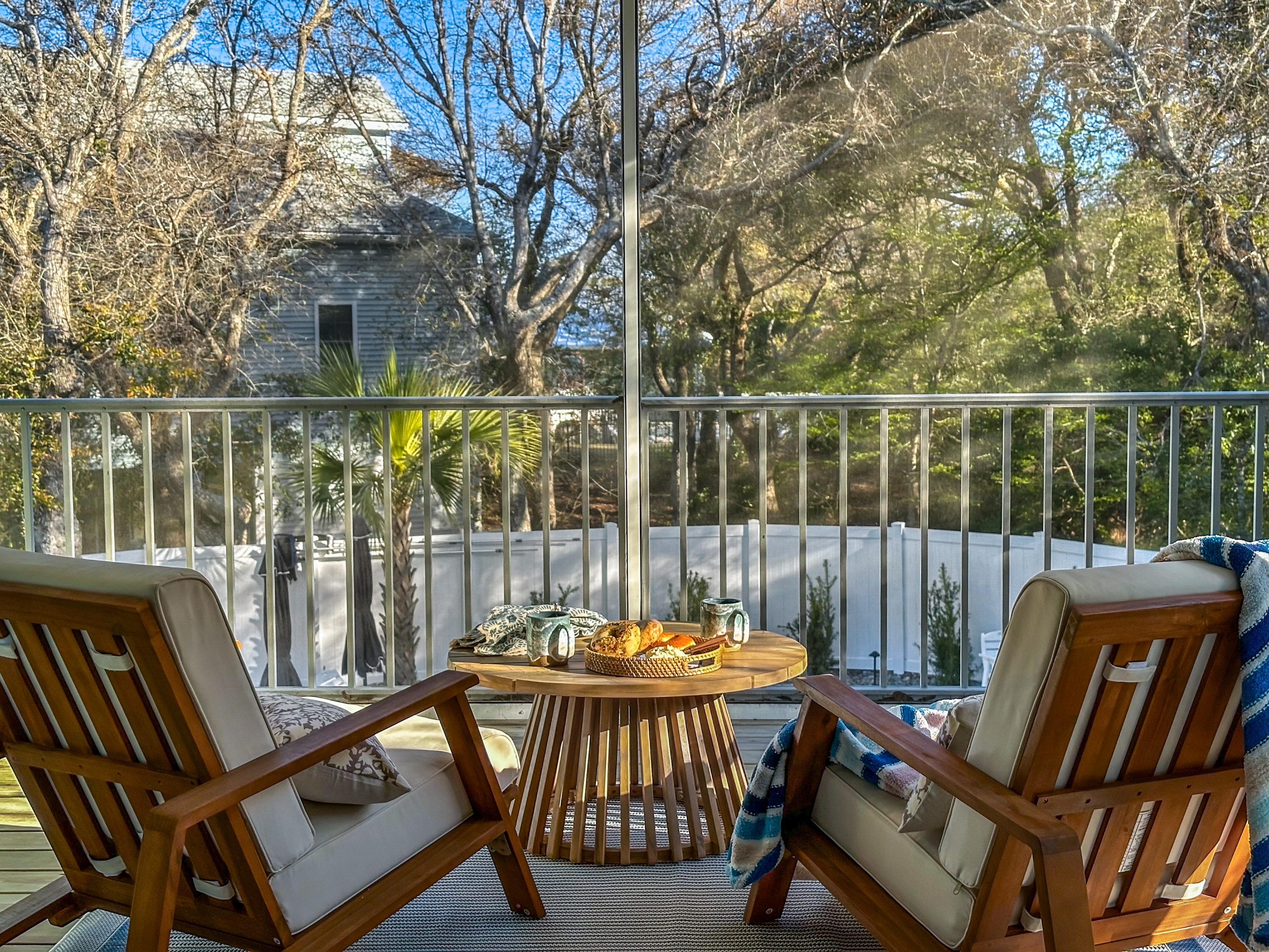 The balcony overlooks the pool area.