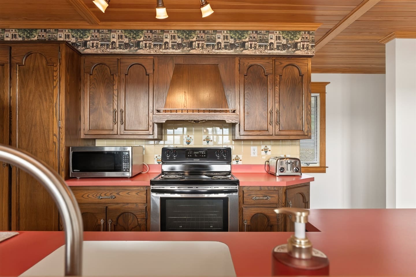 Fully equipped kitchen and coffee station with drip coffee maker, Keurig (K-cup), and tea setup—complete with spices, cookware, kid-friendly dishes, and beautiful tableware, making it easy to prepare anything from morning coffee to family meals