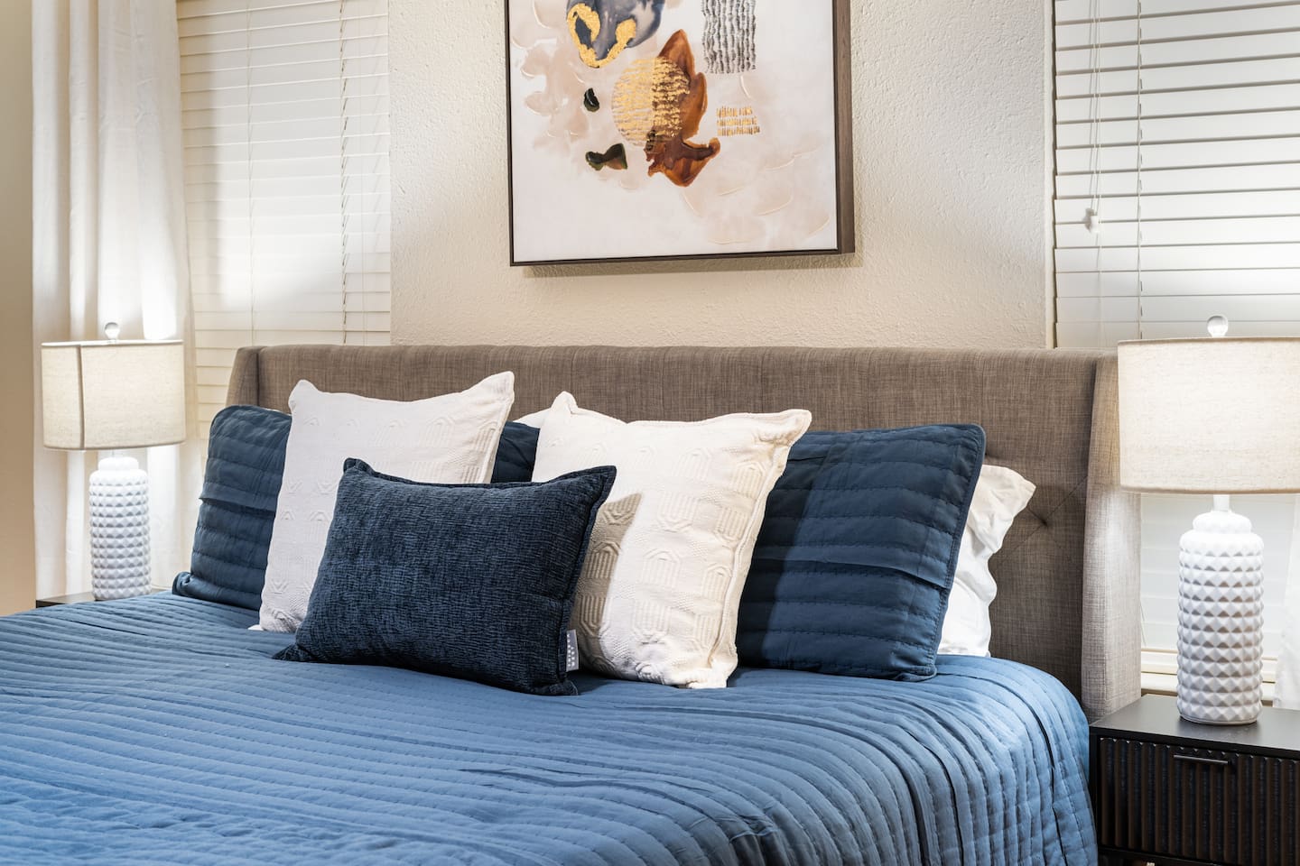 Unwind in a cozy, designer-styled bed with plush pillows and soft textures — your perfect sleep sanctuary.
