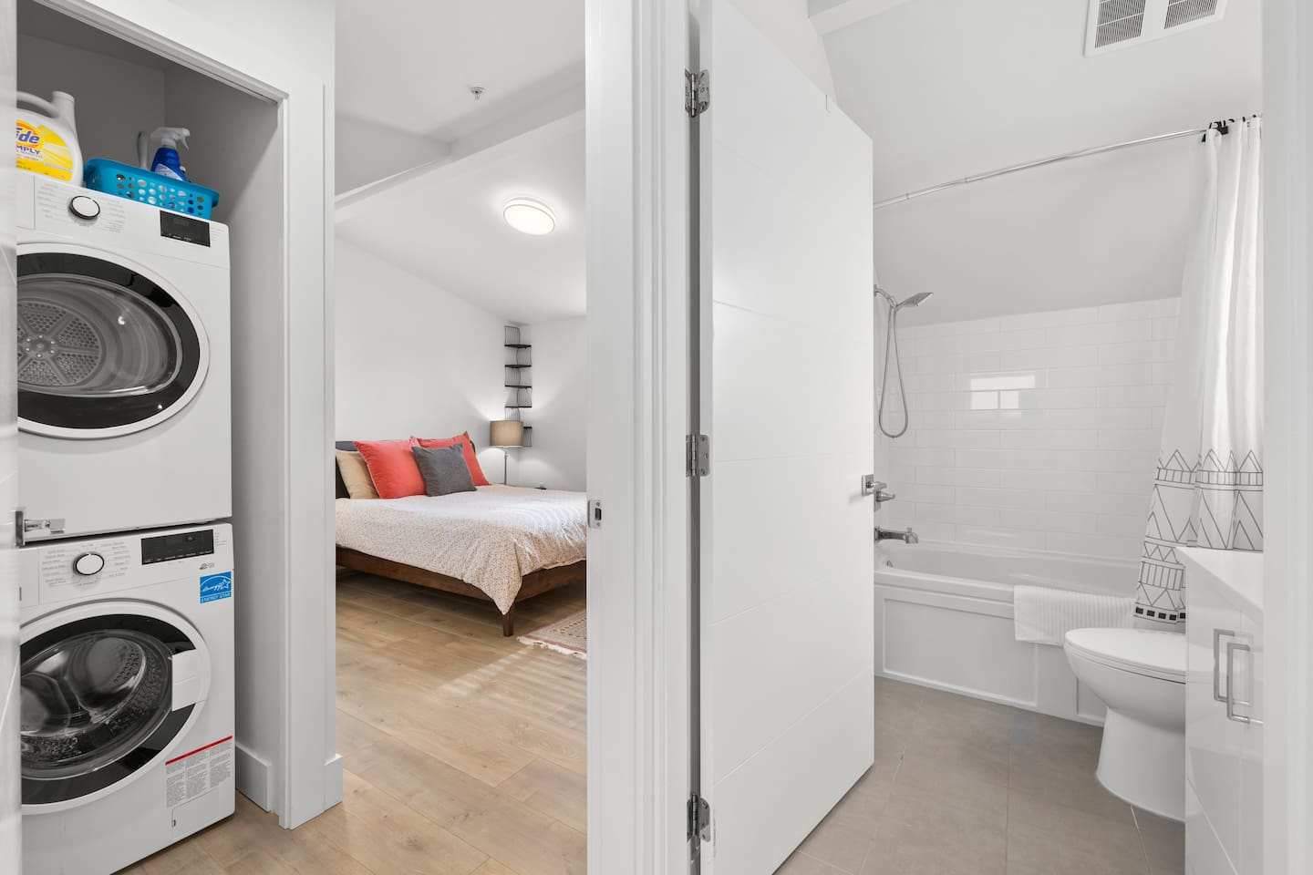 Upstairs: good sized bedroom with queen bed, full bathroom, laundry and a small storage area.