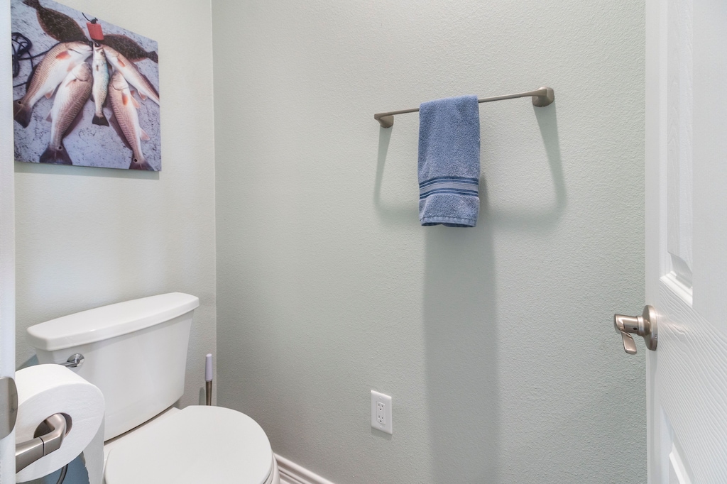 Half bathroom, located off of the kitchen/living area