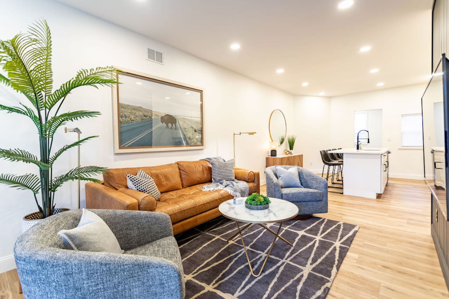 Modern living room featuring comfortable couches, perfect for relaxing and unwinding.