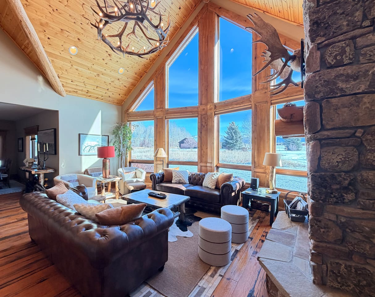 Gather, relax, and make lasting memories in this breathtaking great room, with a wall of windows that flood the space with natural light. Take in incredible views as you unwind in a warm, inviting space designed for connection and comfort!
