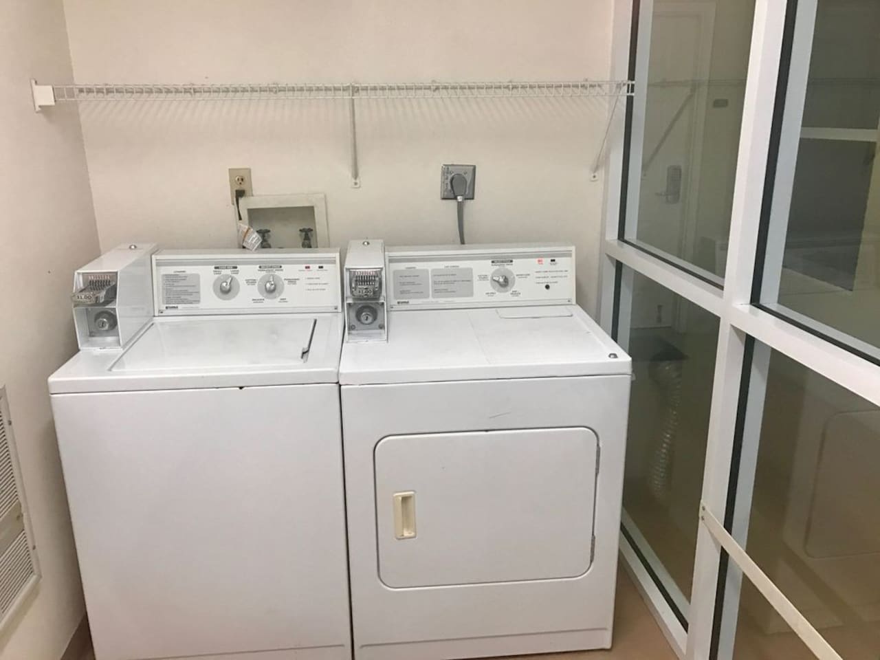 Coin operated washer and dryer just a few steps away from the unit. load and leave...