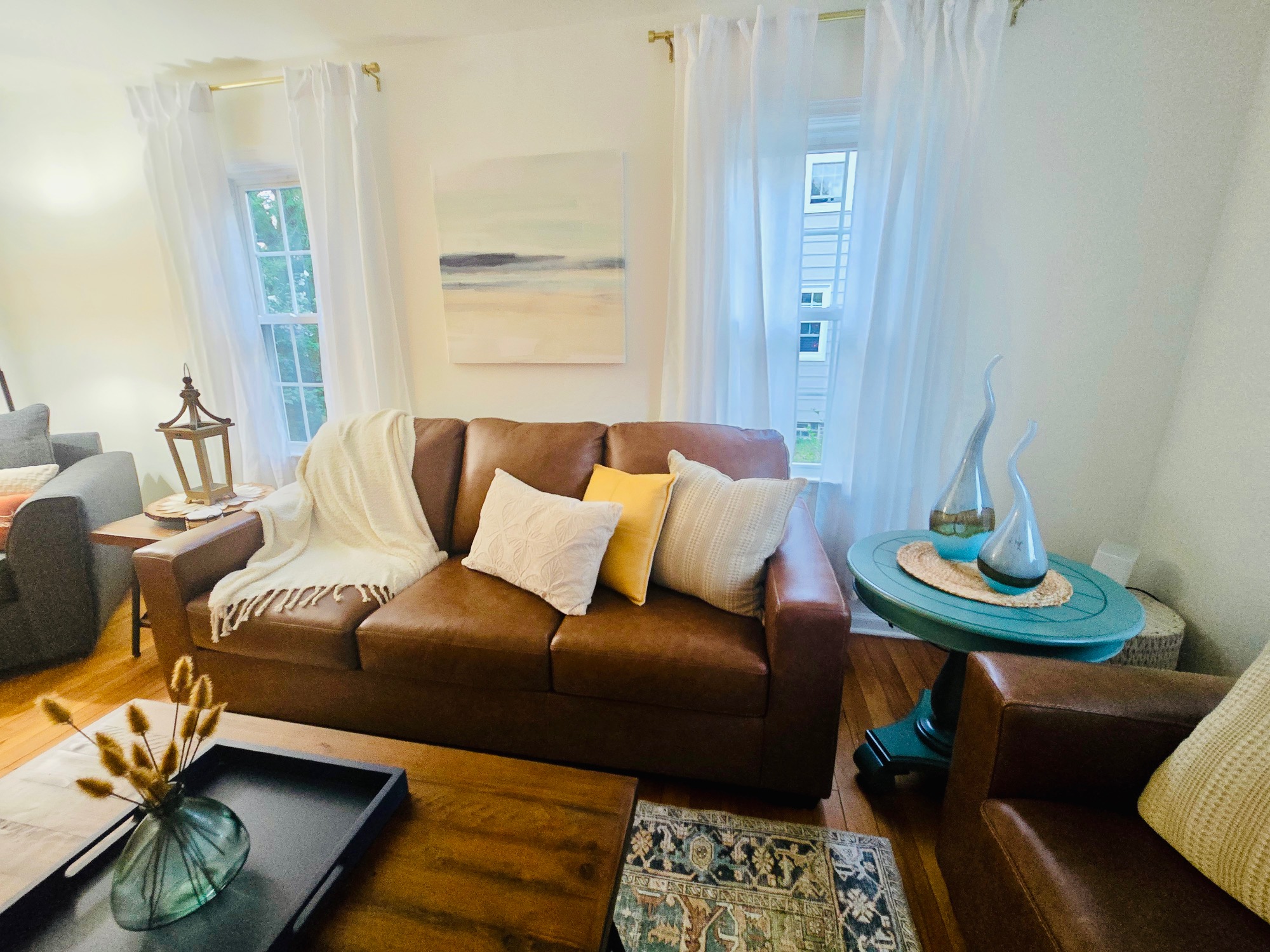 Natural light, layered warmth, and timeless hardwoods—welcome home.