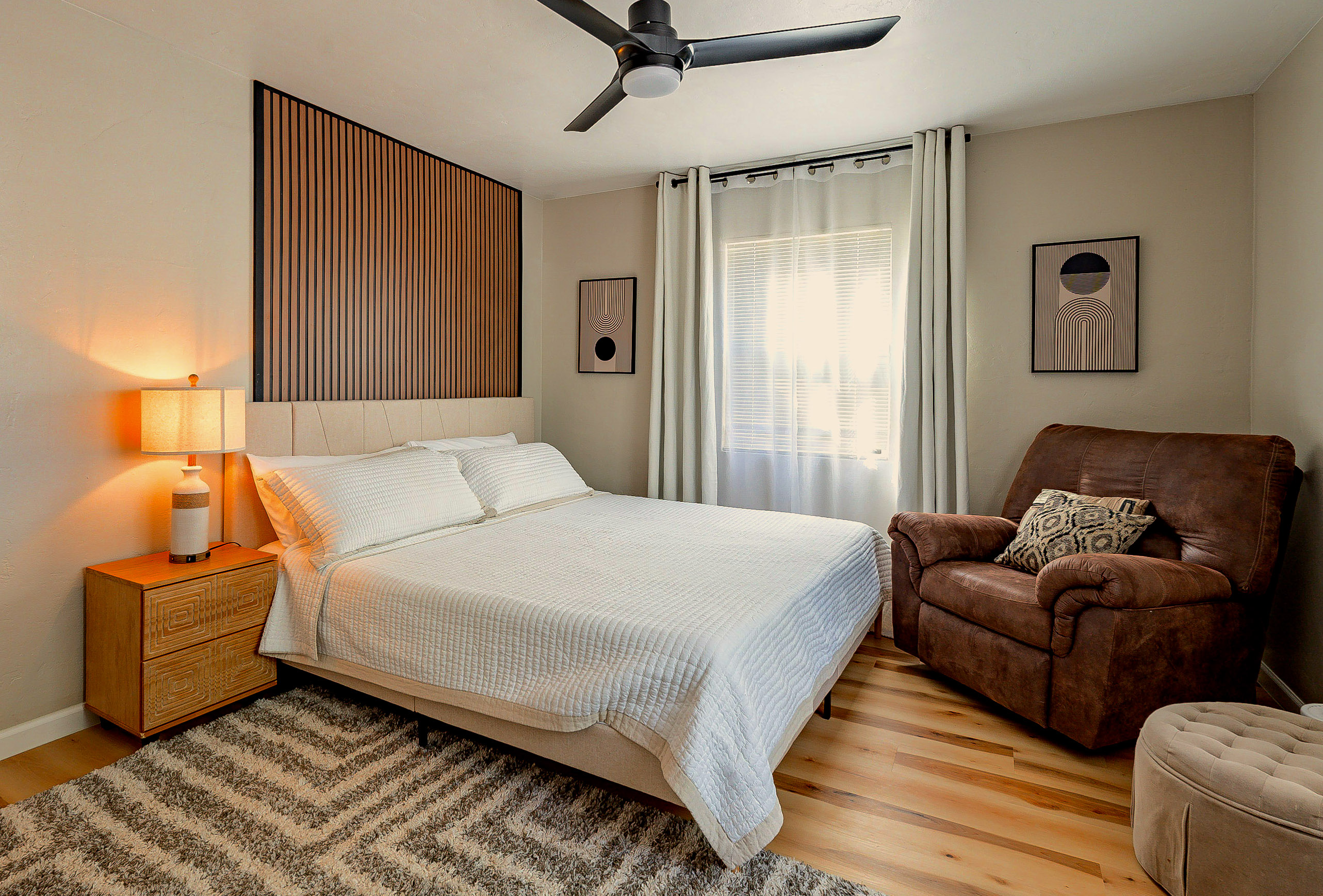 Bedroom Retreat: Relax in style with a plush king bed and artistic decor!