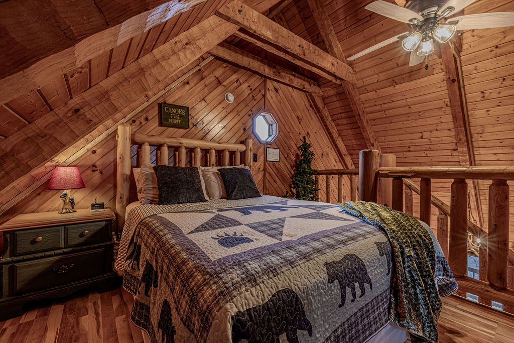 Queen bedroom in the loft with skylights