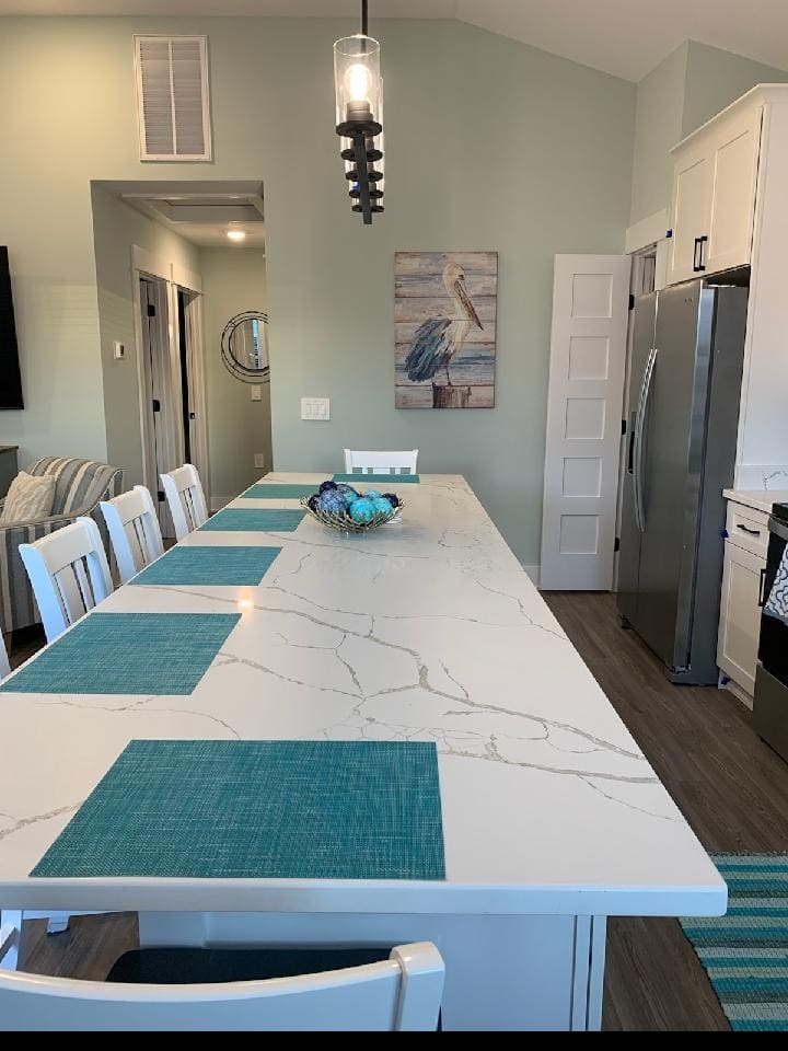 Oversized center island includes power outlets with USB charging ports. 