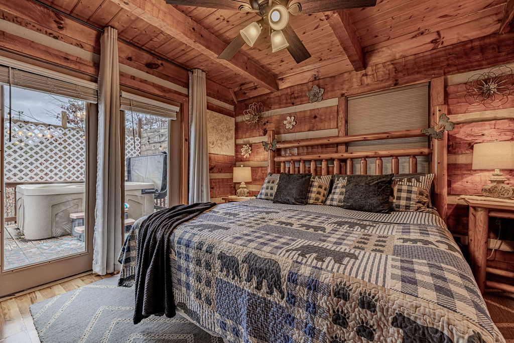 Bedroom with doors opening to the deck