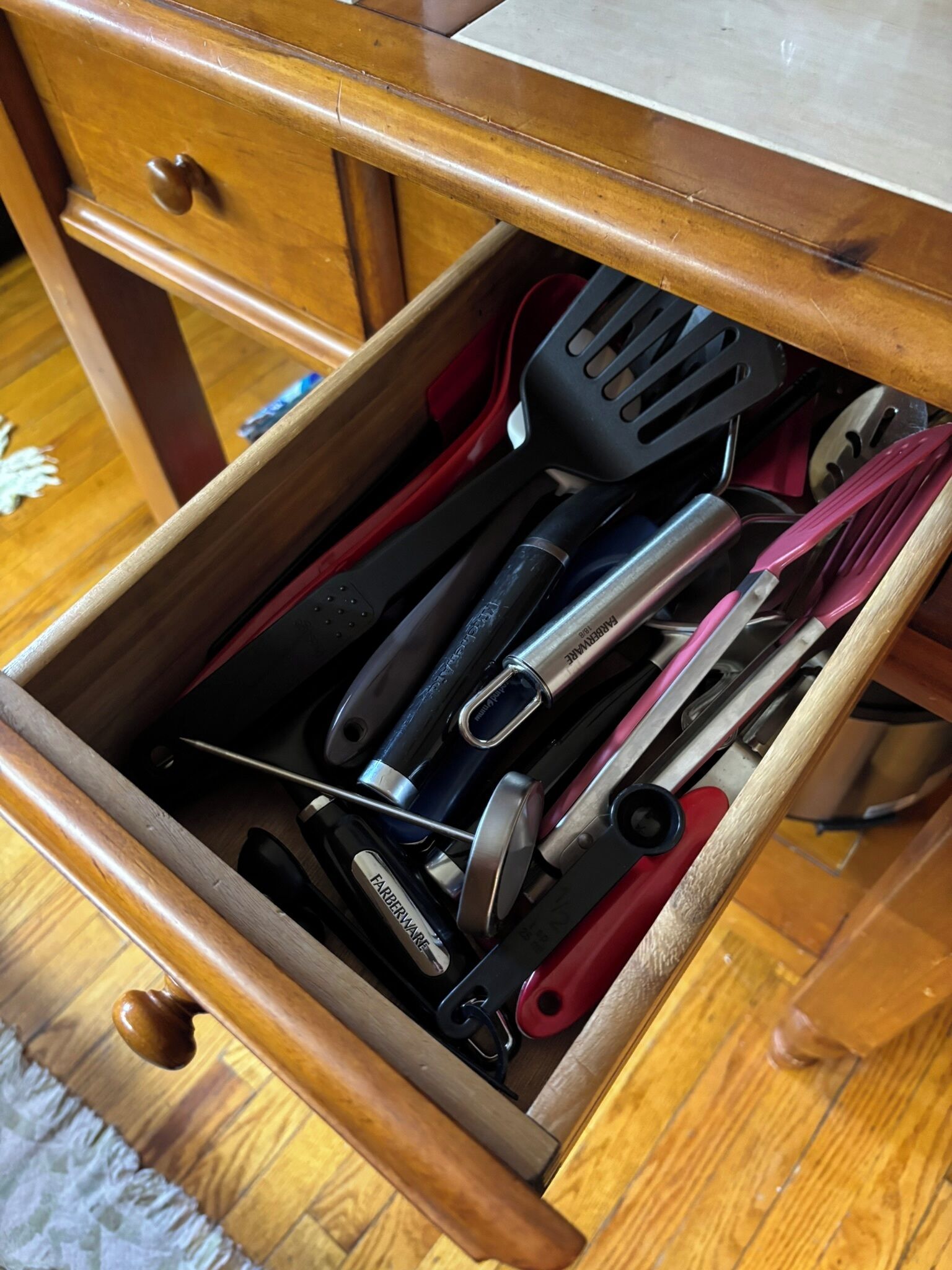 Lots of utensils to choose located in the kitchen island.