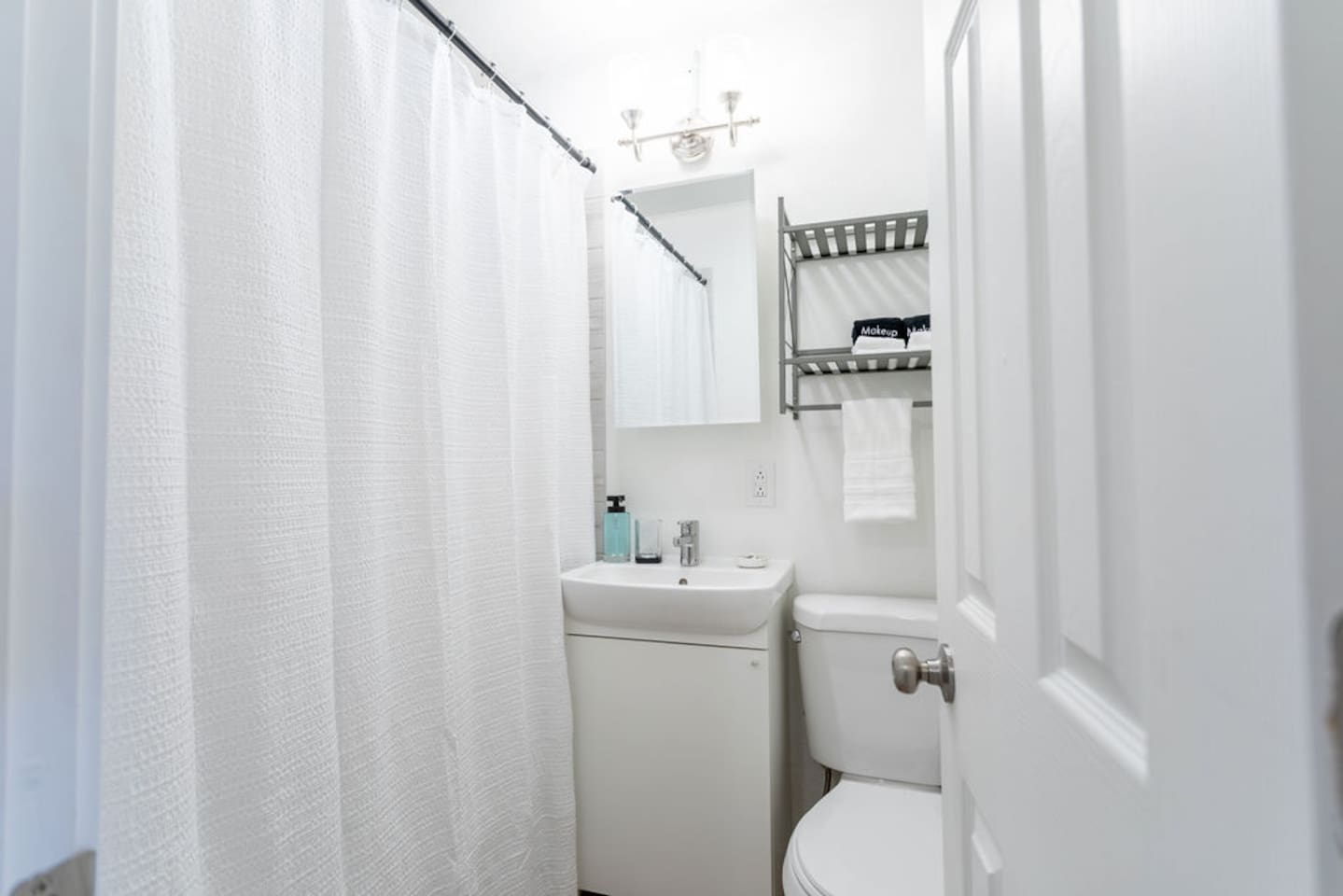 Modern full bathroom with sleek fixtures and plenty of space for a refreshing and relaxing experience.
