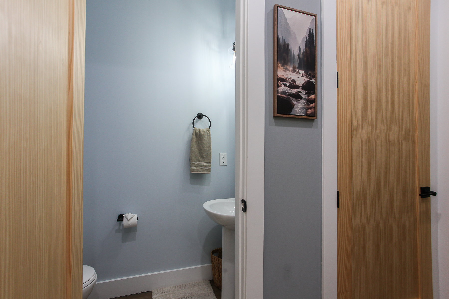 A conveniently located main-level half bath adds extra comfort during your stay at Robbin’s Nest on Snowbird Creek.