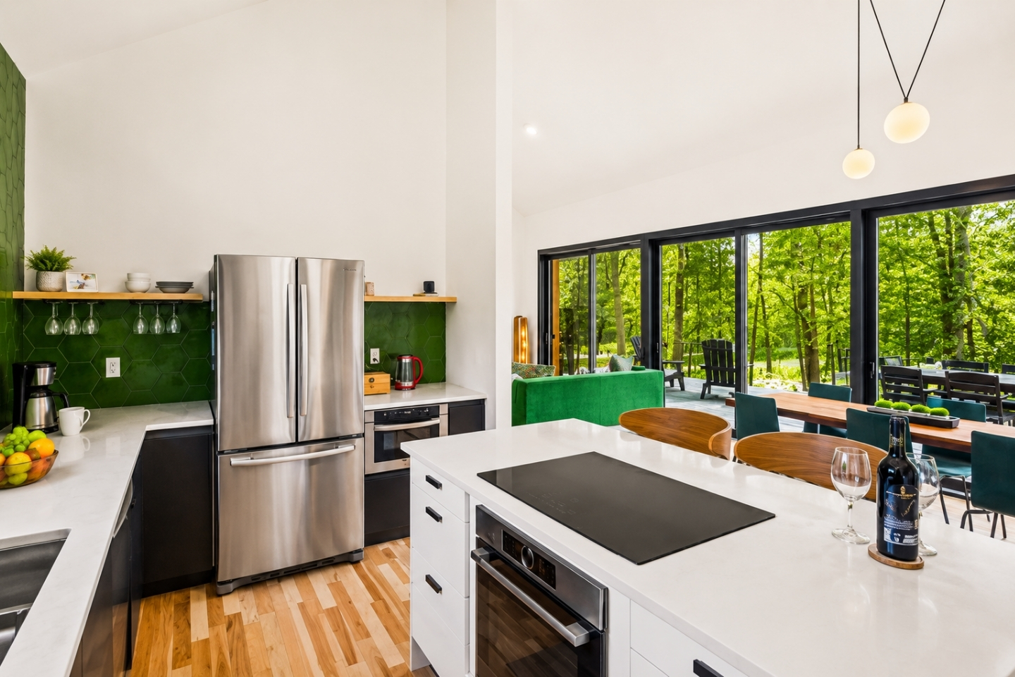 Experience a vibrant, refreshing kitchen where nature meets modern design. This stunning space features a bold green accent wall that brings a sense of calm and rejuvenation to the heart of your home. 