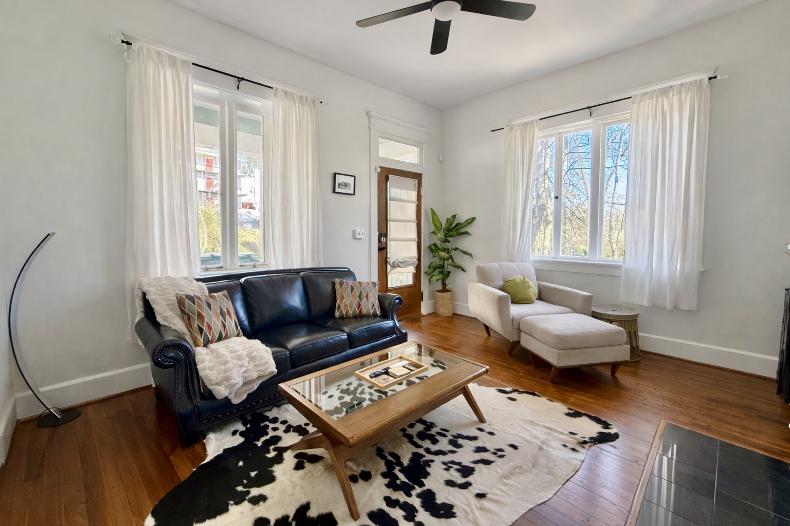 Experience our living room adorned with unique artwork, where creativity meets comfort.