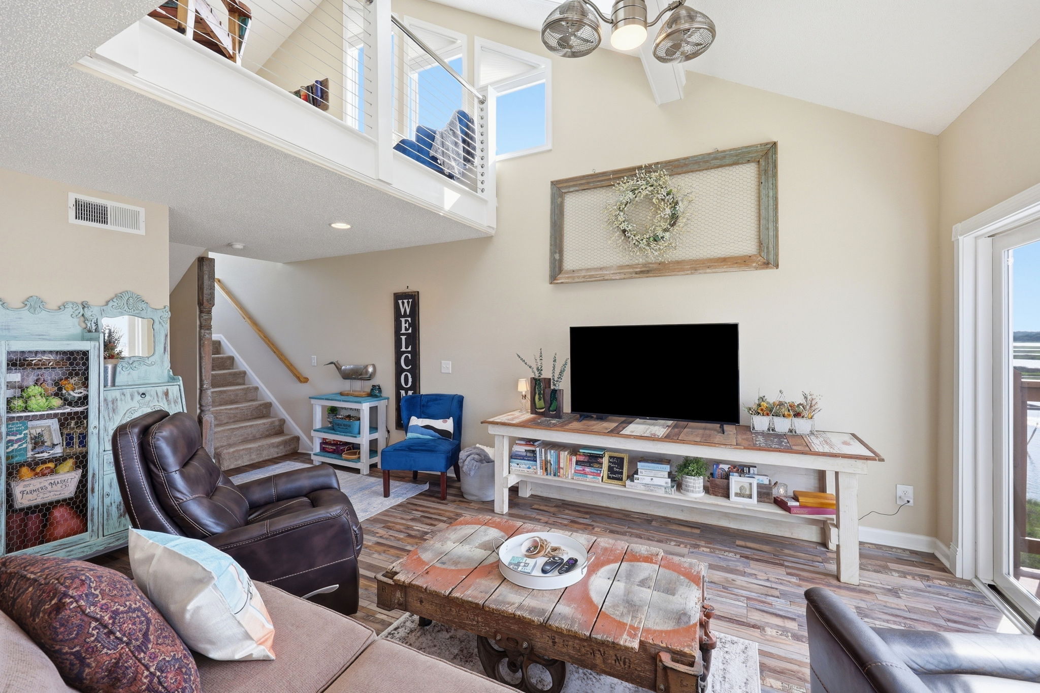 Relax with a good book or gather for movie nights in this comfortable coastal retreat. Large windows bring the beauty of the coast right into the living space.