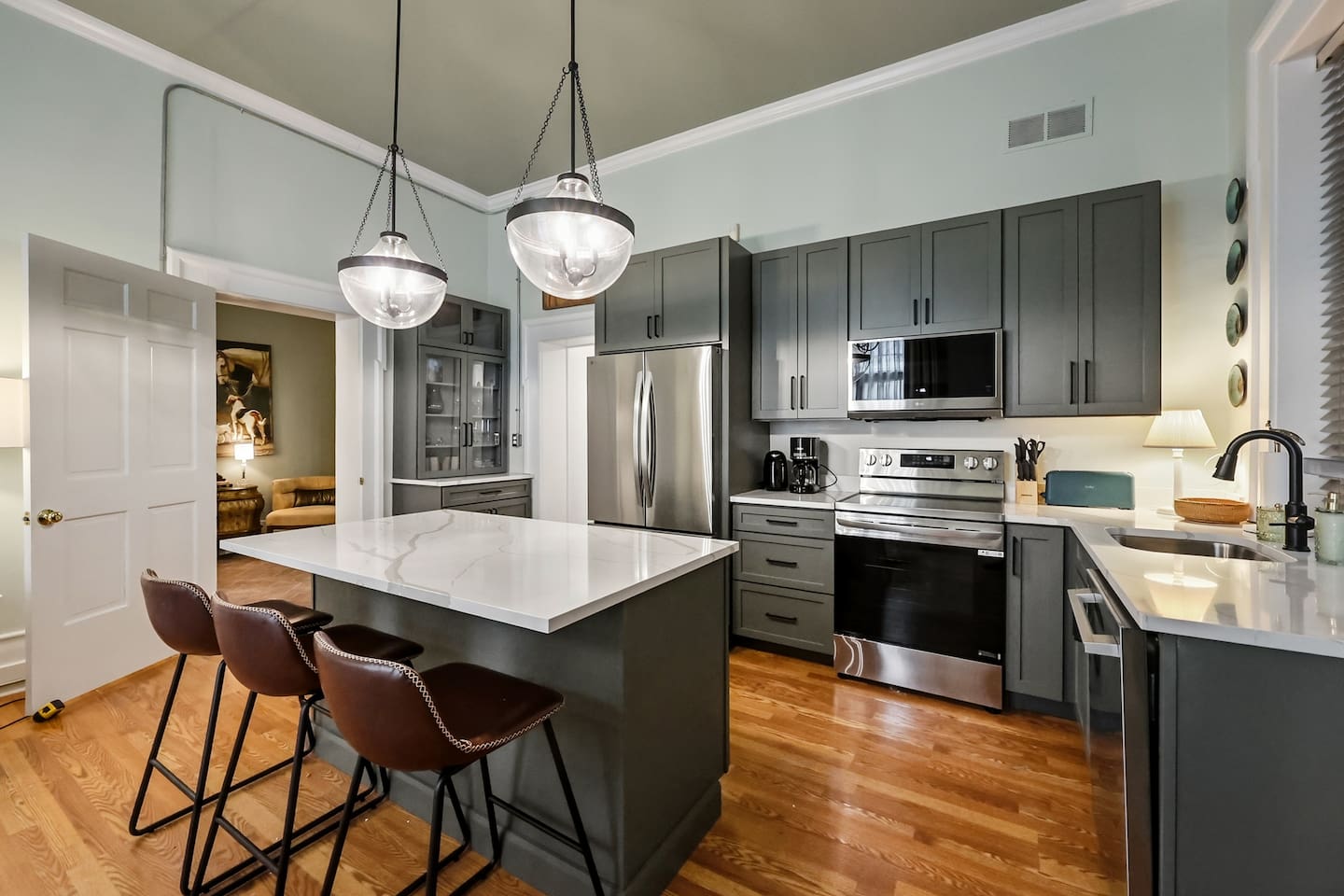 Large kitchen island seats three. 