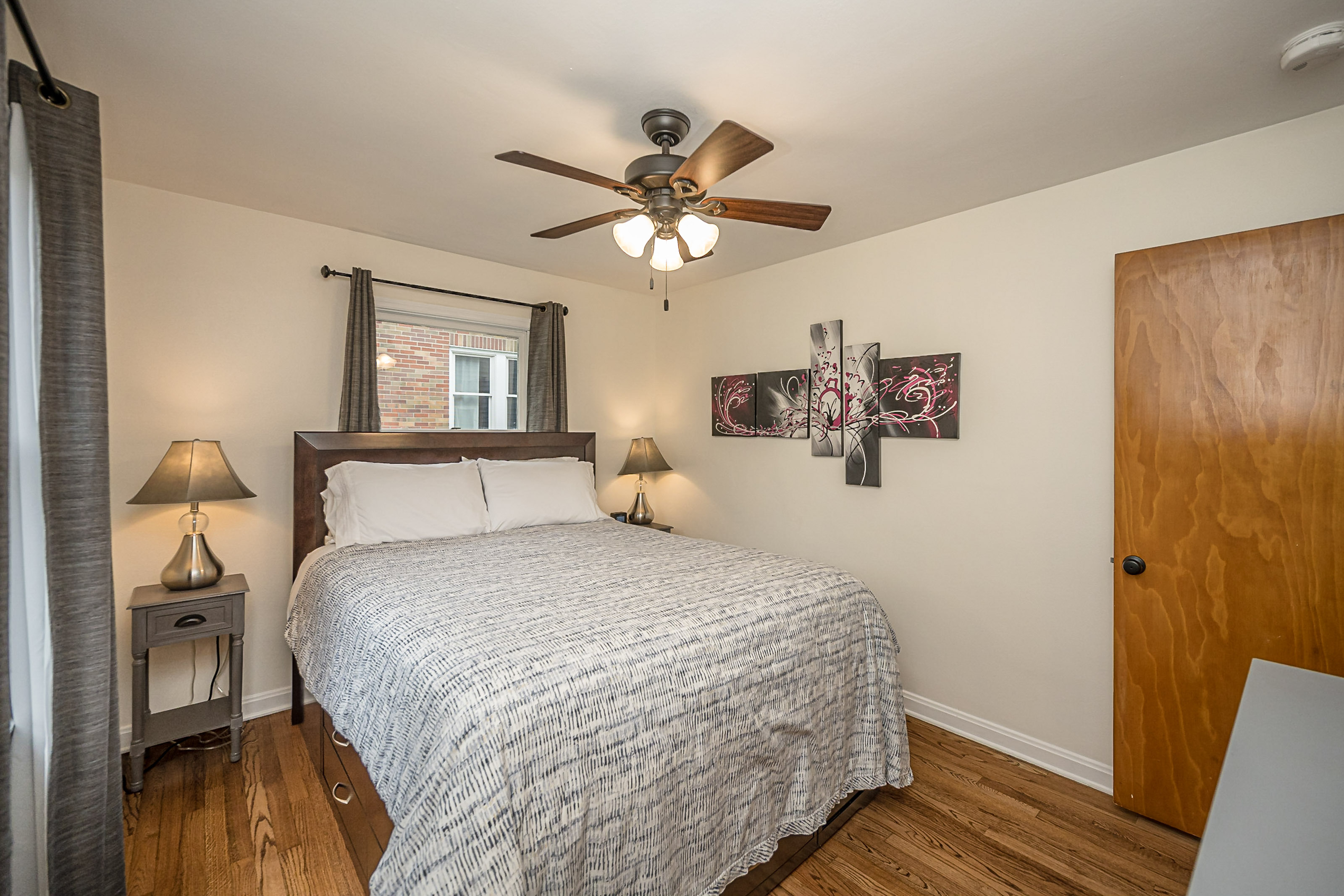 Main floor bedroom features a comfortable queen bed.