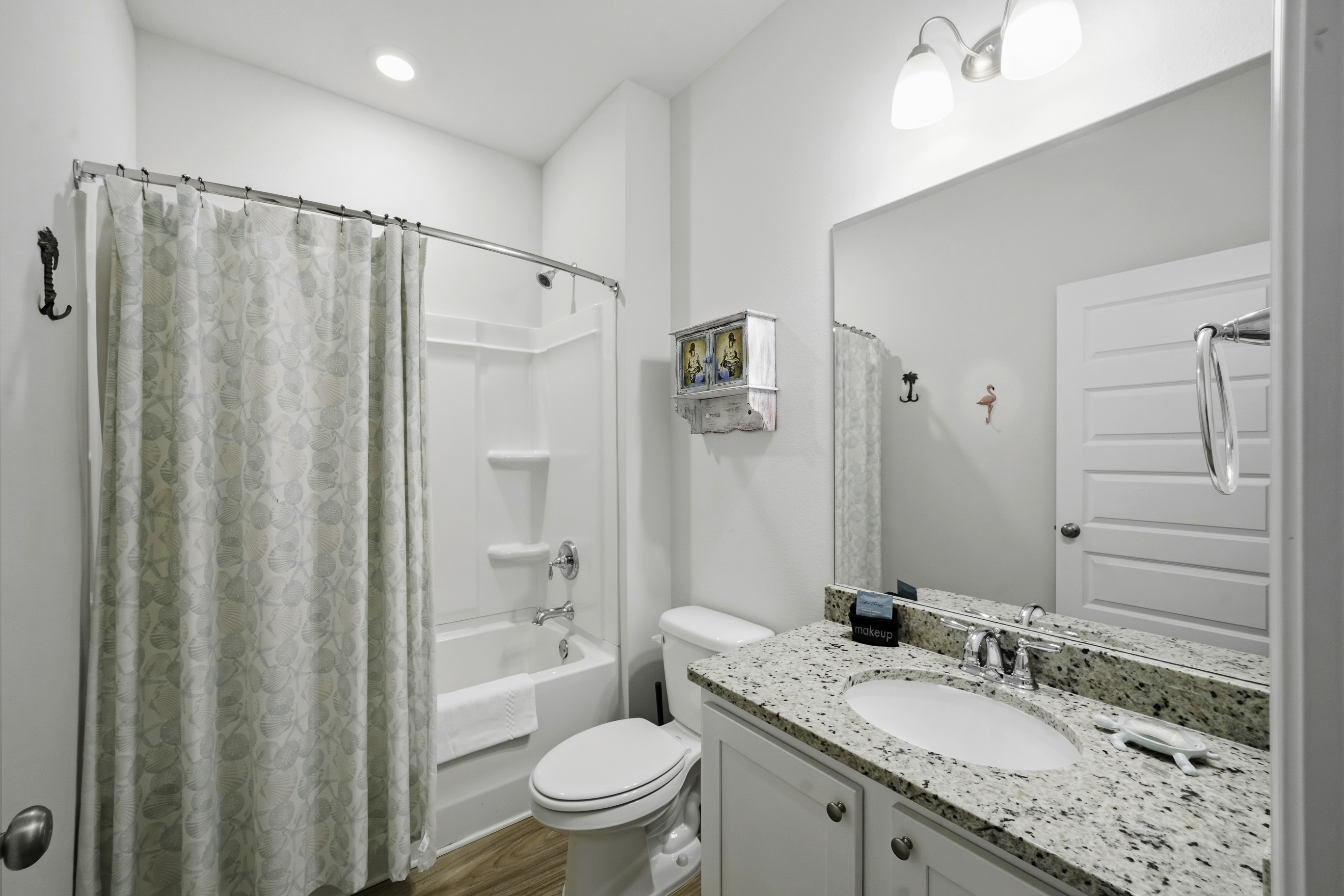 mother-in-law bathroom - tub/shower combo single vanity.
