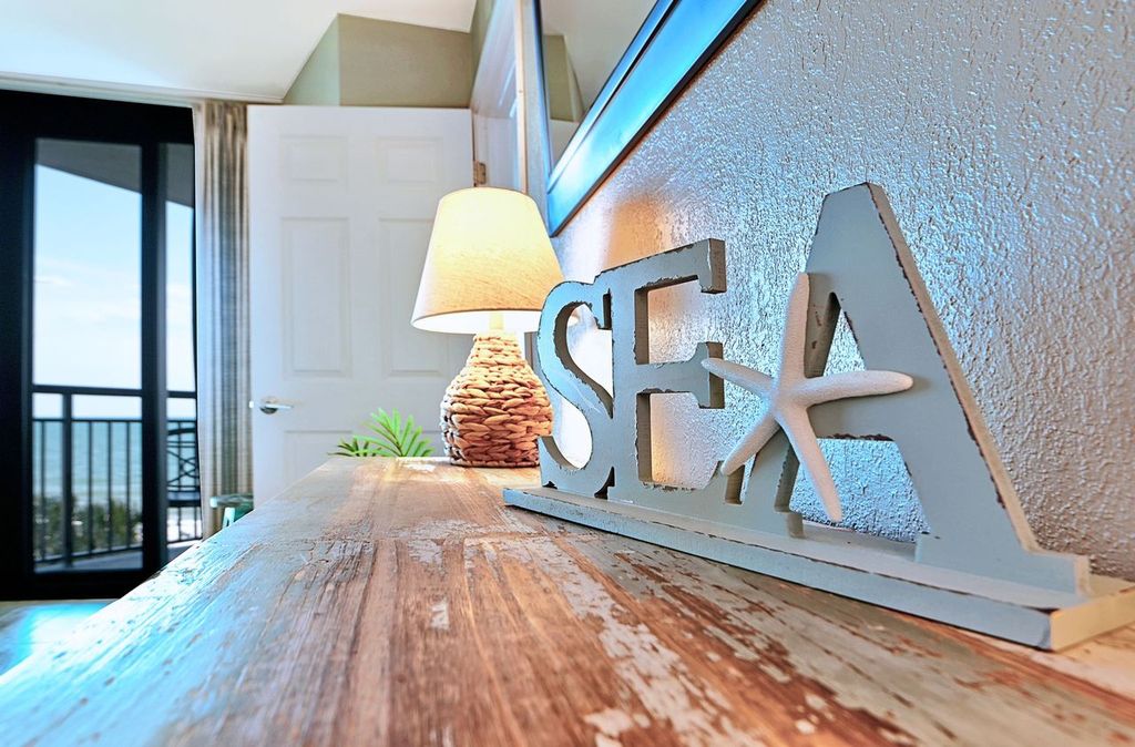 Rest up after a day in the sun in this plush, coastal-themed master suite.