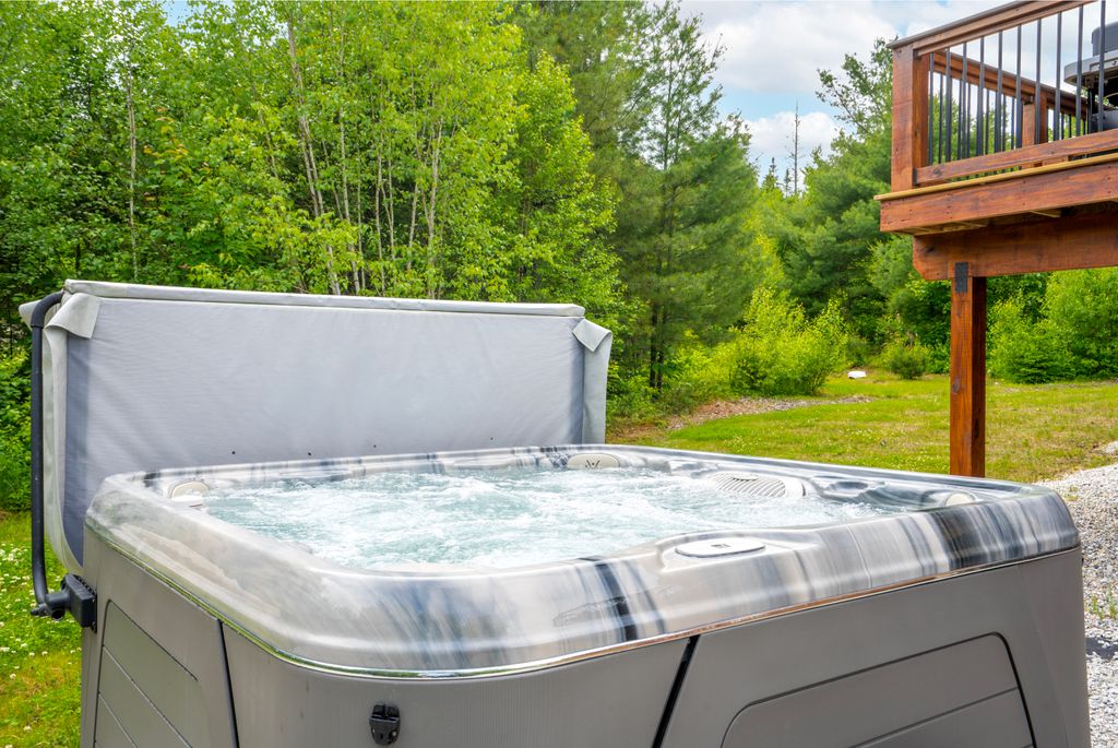 Indulge in a luxurious soak in the hot tub, where comfort and relaxation come together beautifully!