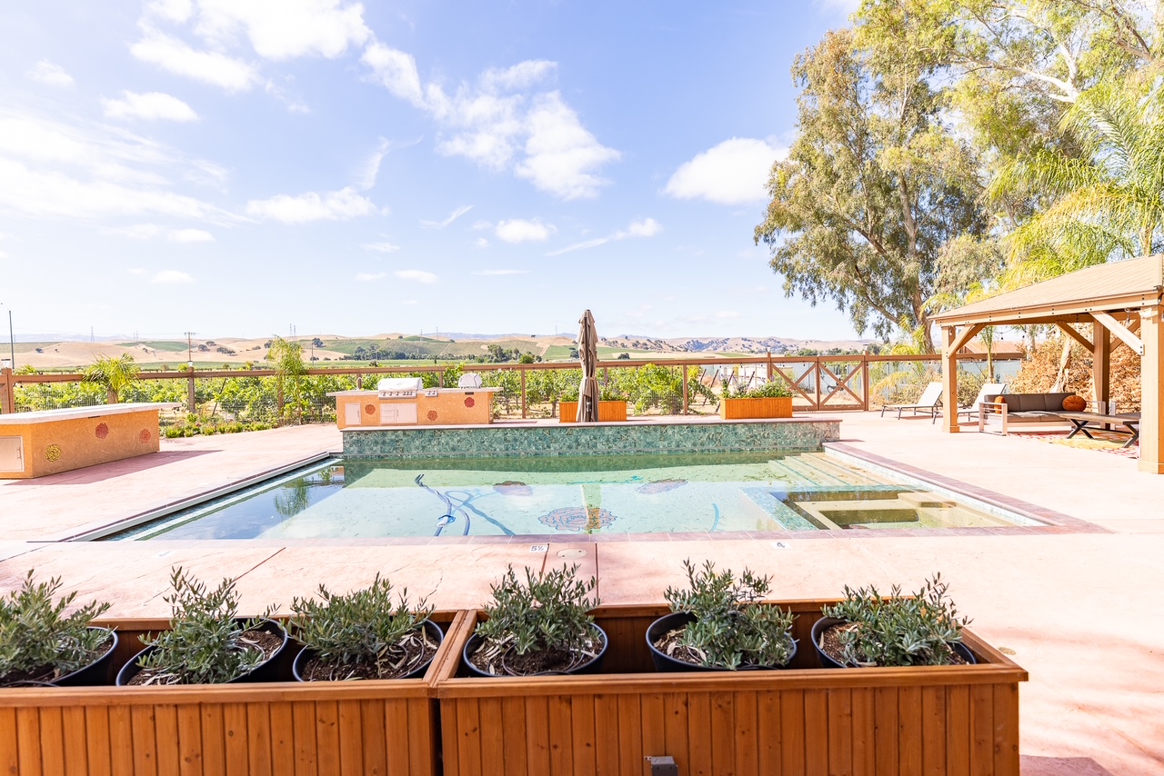 Our new pool, BBQ, fire table, and gazebo. Stay tuned for furnishings!
