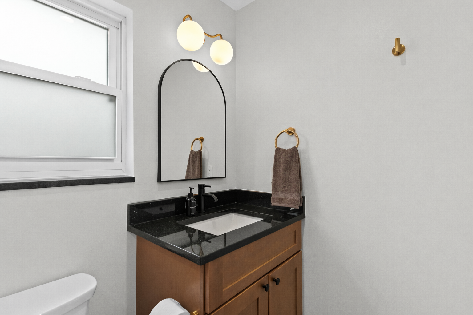 Stylish bathroom vanity with modern lighting, sleek finishes, and thoughtful storage—bright, clean, and designed for a refreshing daily routine.