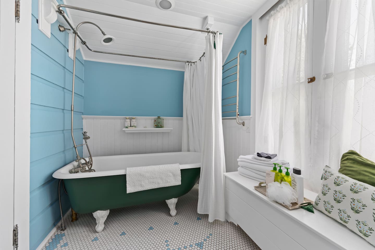 Enjoy this original restored clawfoot tub, rainfall shower, heated towel rail, and plenty of towels and toiletries. 