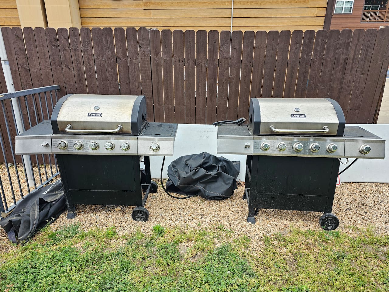 Outdoor community gas grills ready for cookouts & family dinners