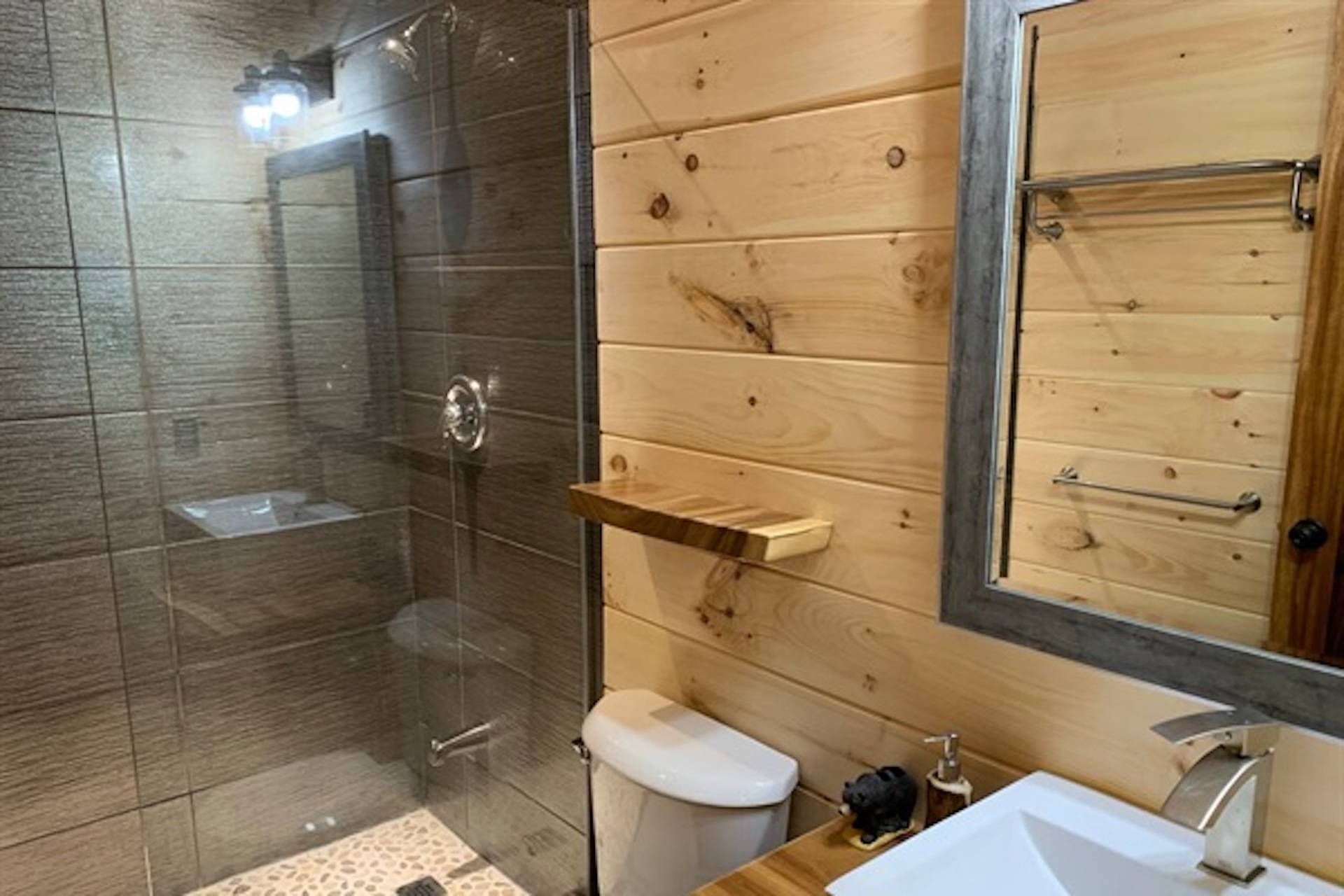 Bathroom with glass shower and practical layout