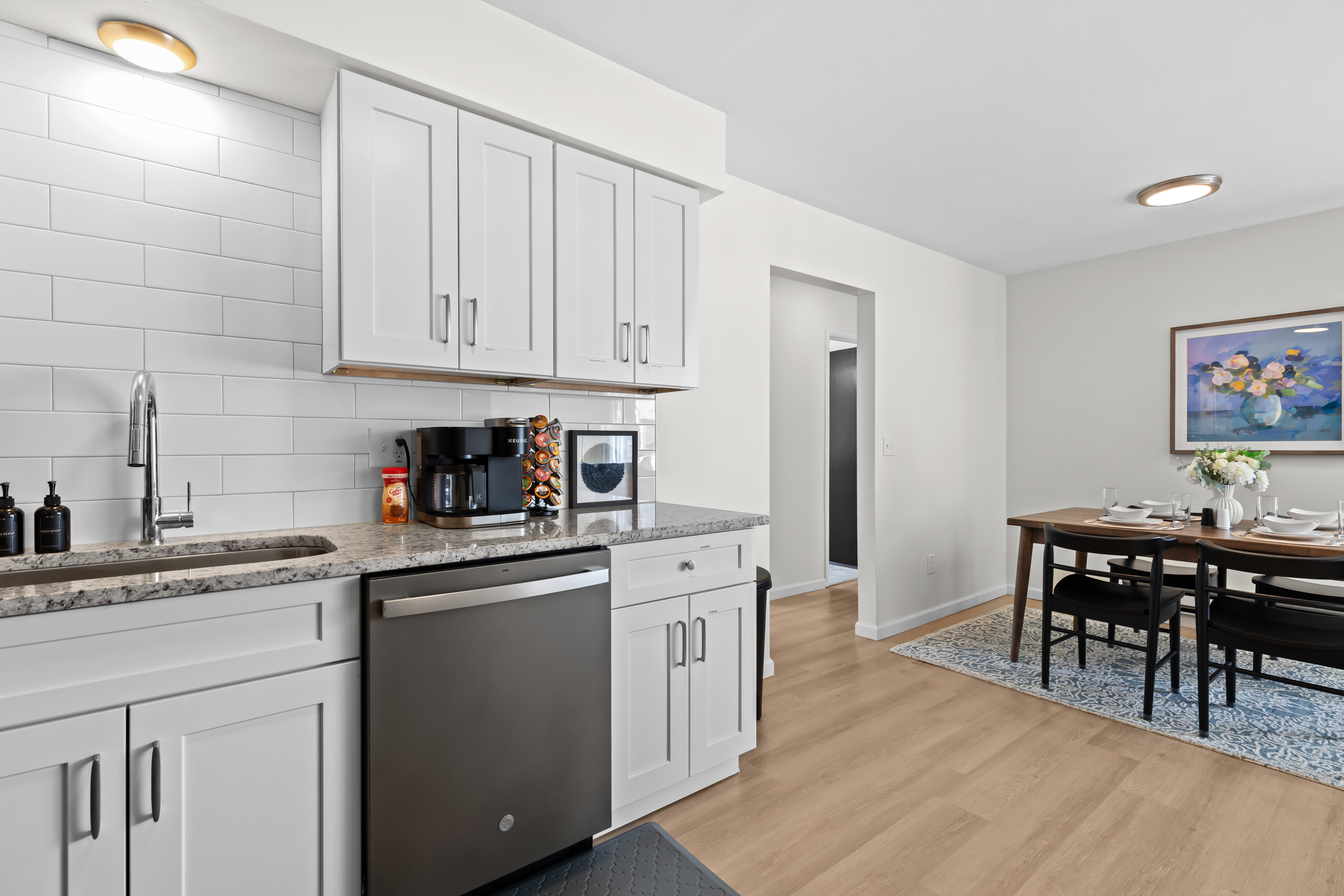 Open kitchen layout with modern cabinetry, spacious counters, and easy flow into the dining area.