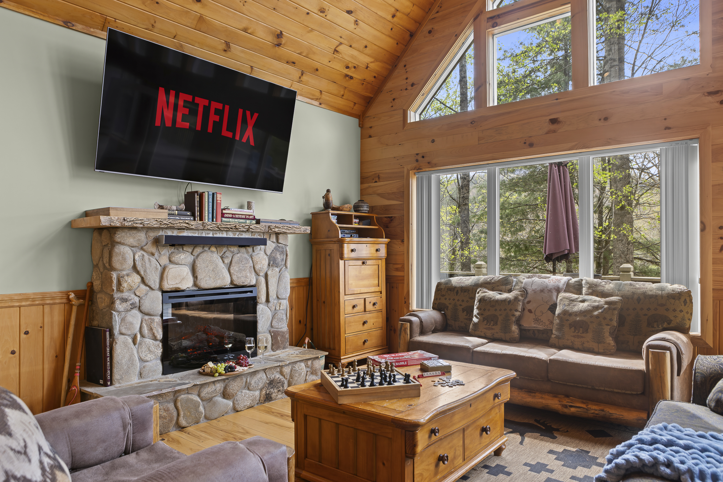 Living Area: Gather around the stone fireplace for game nights or movie marathons!