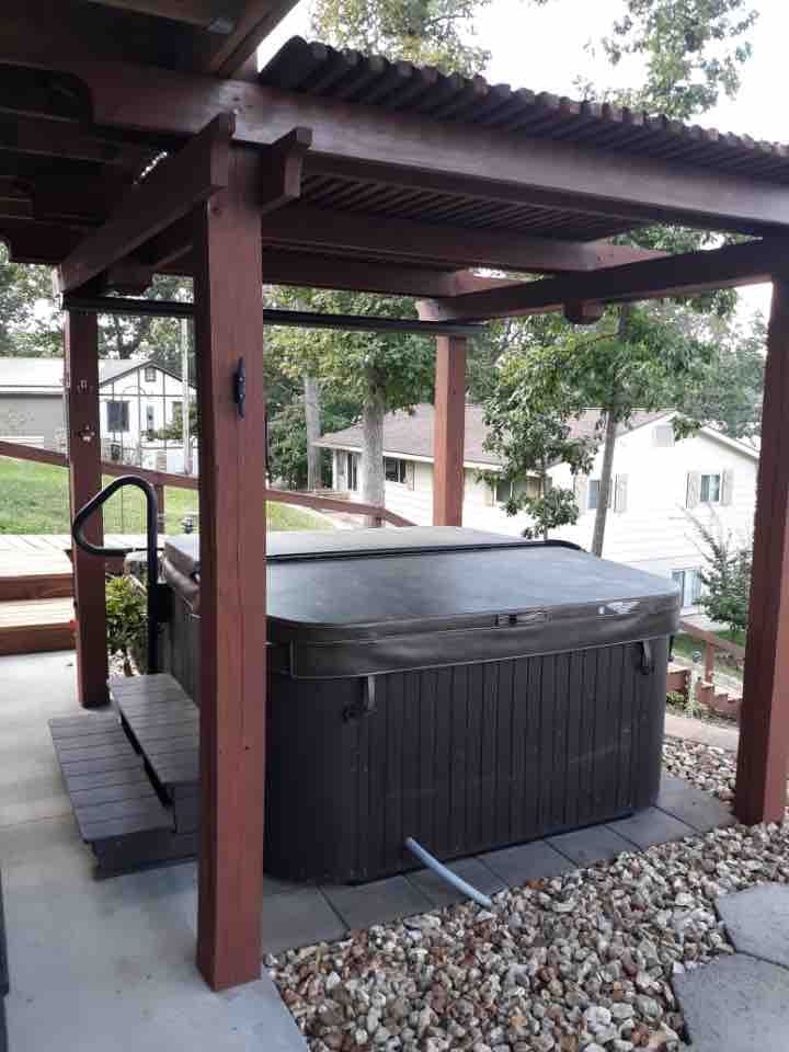 Enjoy the covered patio hot tub jacuzzi with waterfalls and LED lighting. 