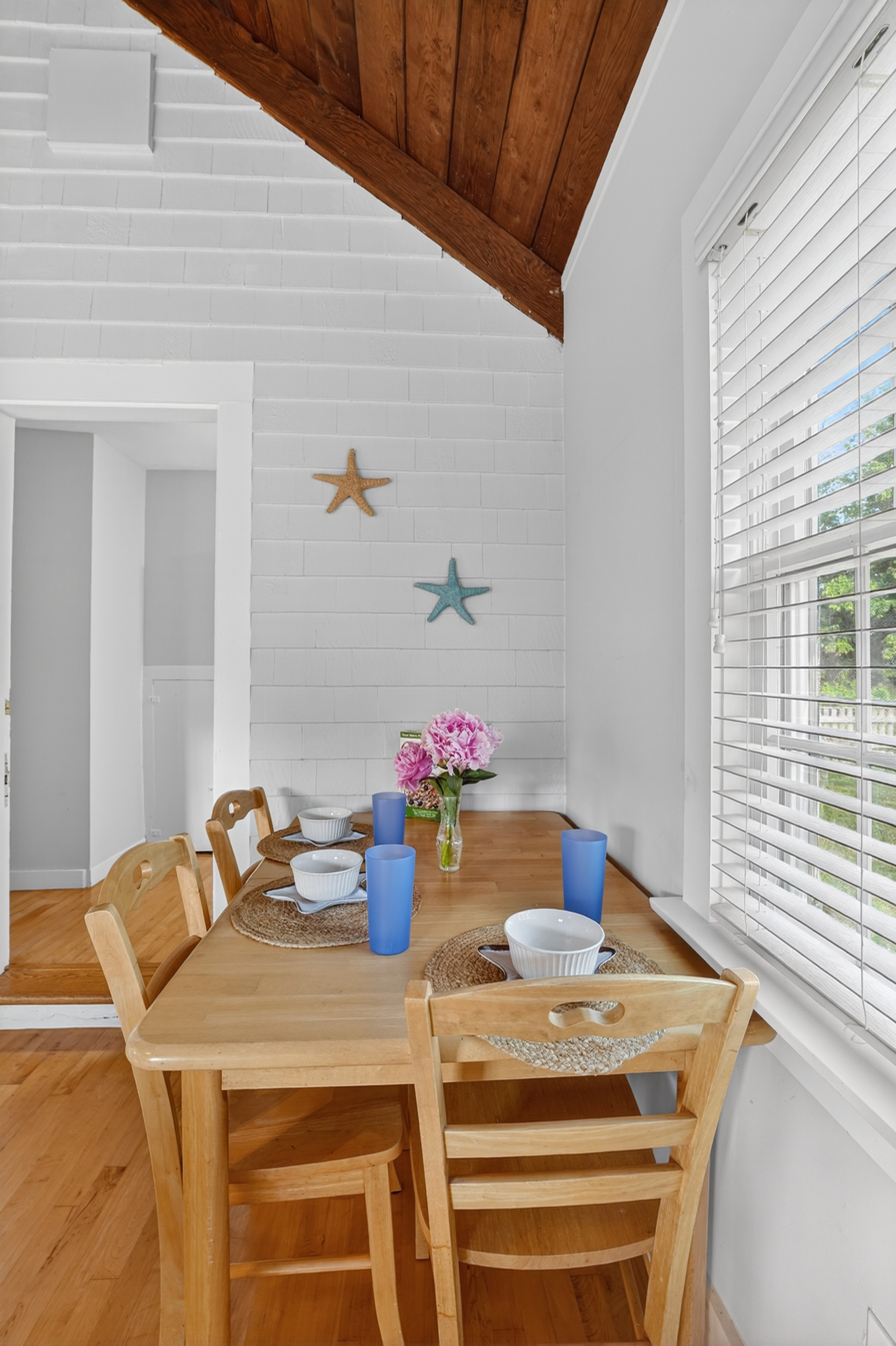 Cozy breakfast nook with seating for four—ideal for morning coffee, quick meals, or family game time.