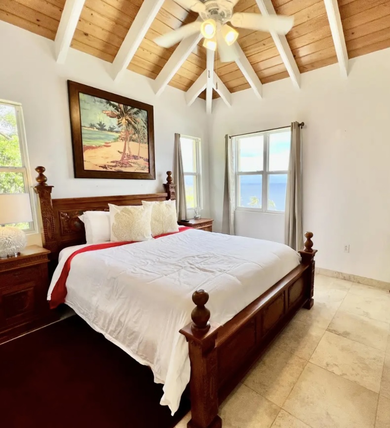 Comfortable king bed with plush pillows—your private space to unwind and recharge.