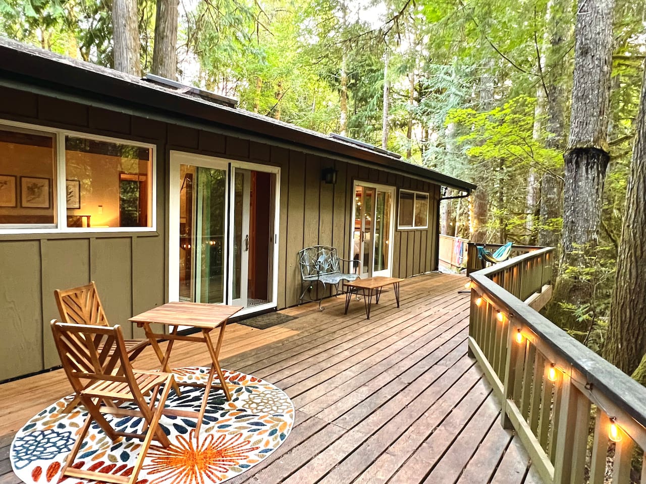 Back Deck on main floor level, overlooking the Sandy River. Access from Main Level Living Room, Master Bedroom, and King Size Guest Bedroom.