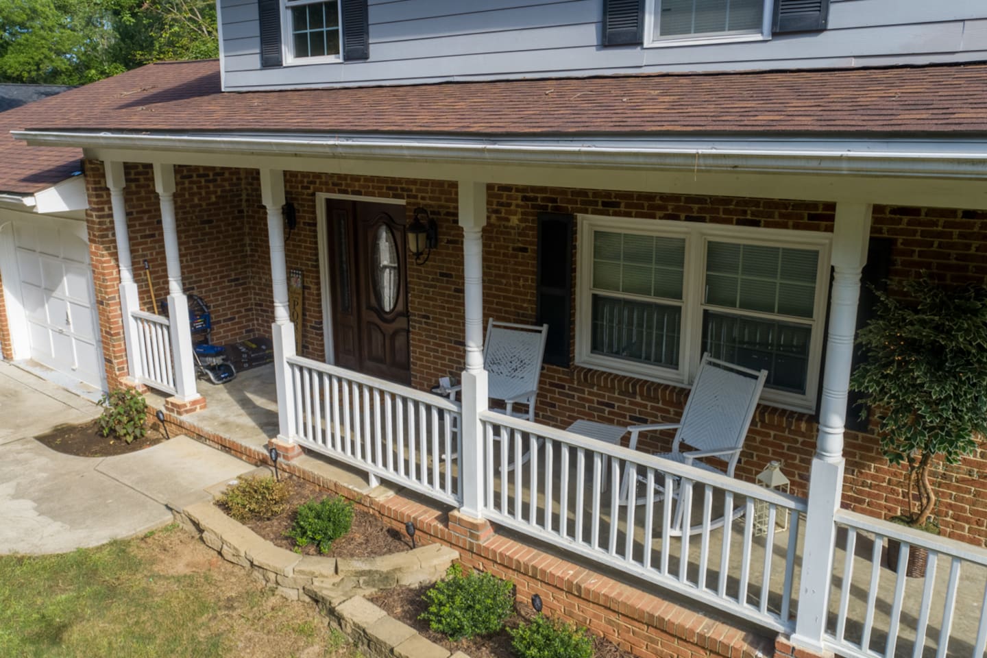 Enjoy quiet mornings or evening chats on the covered front porch, complete with classic Southern-style rocking chairs. 