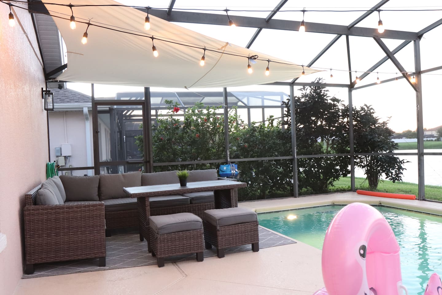 Covered oversized sectional patio seating perfect for outdoor meals or lounging. POOL HEATER available upon request for a daily fee. 