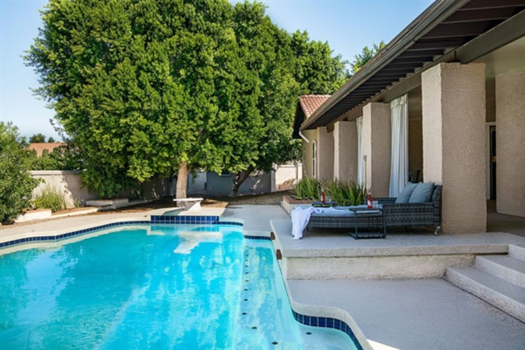 Unwind by the heated pool with plush seating and total privacy for the perfect desert getaway.