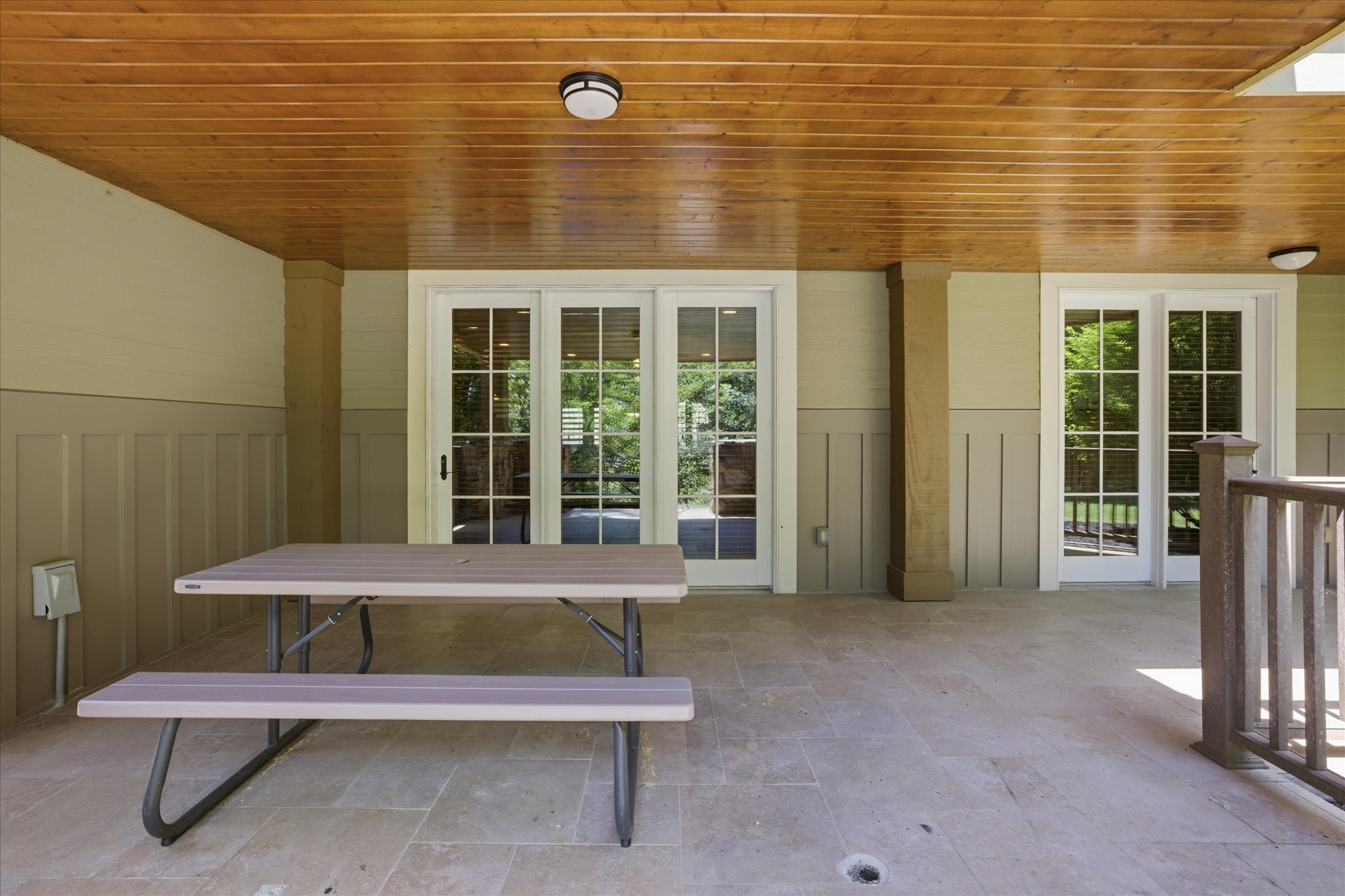 Gather on the covered porch with a picnic table ready for meals, conversation, or just unwinding while you take in the peaceful surroundings.