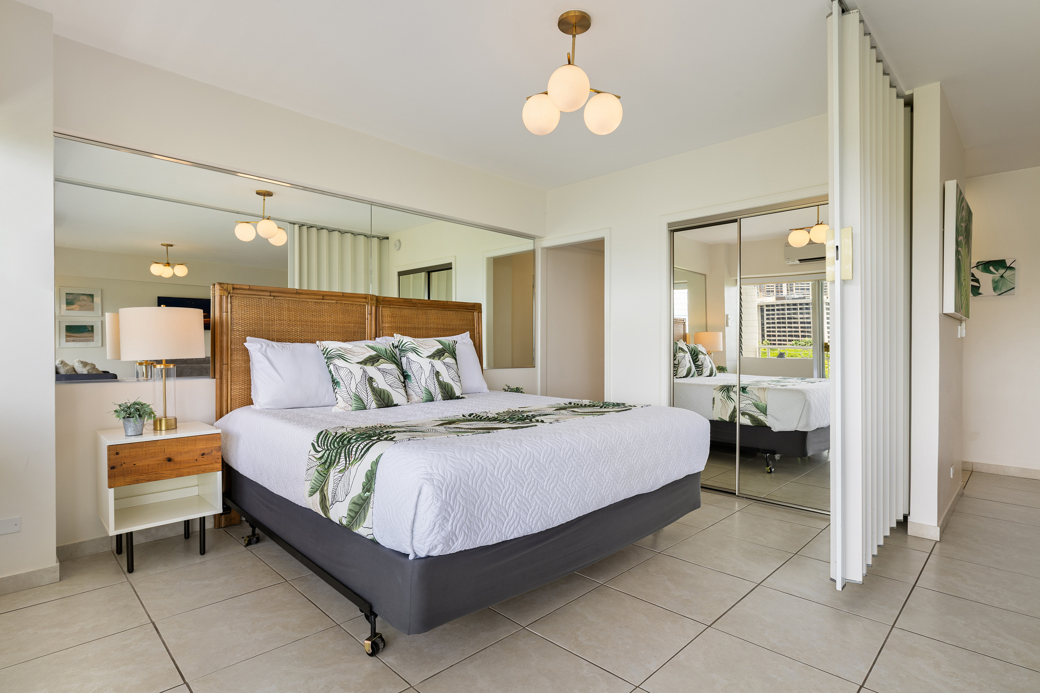 Bedroom with king bed and accordion pocket door for added privacy from living area