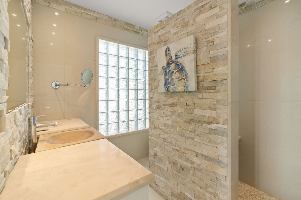 Primary Ensuite Bathroom wrapped in travertine